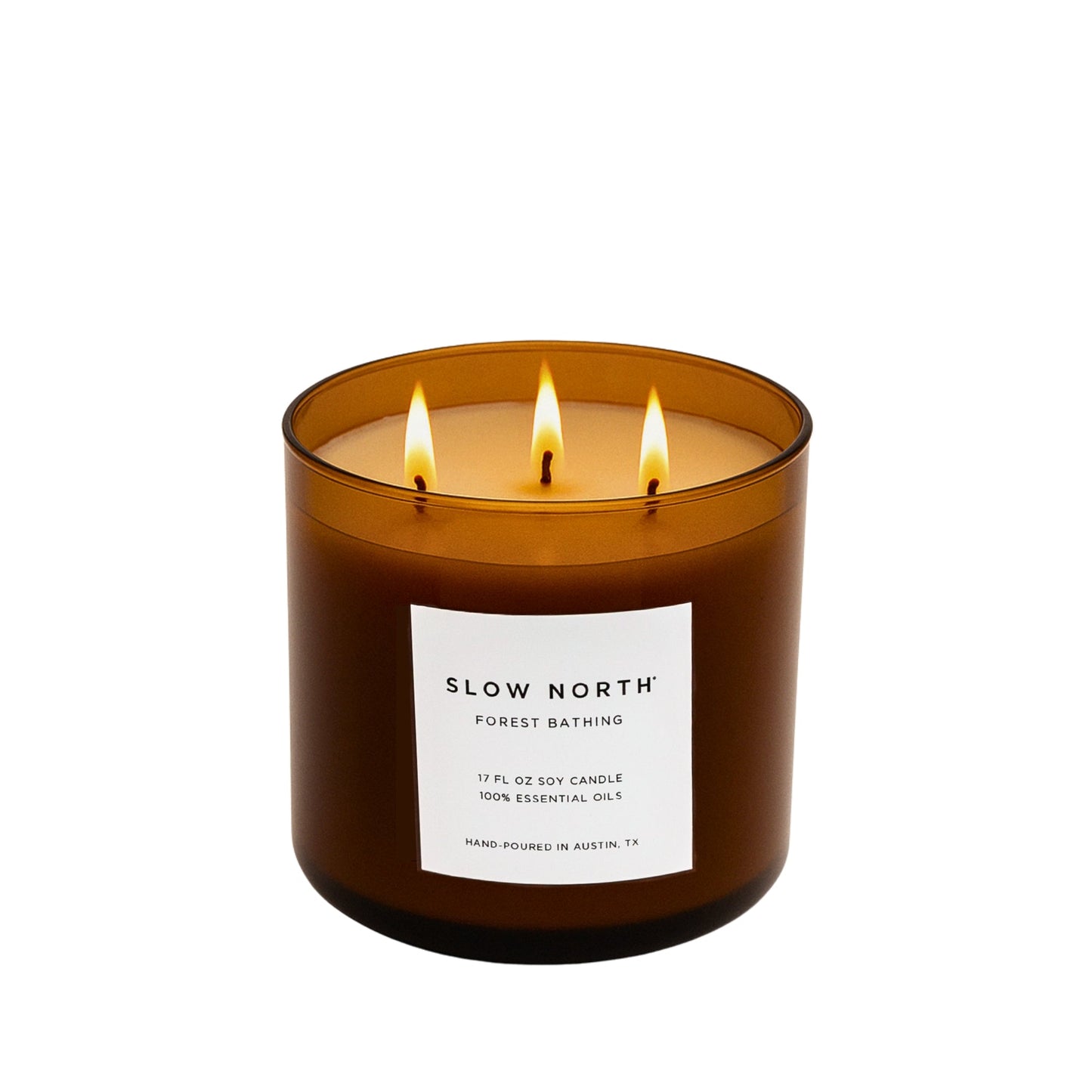 Slow North Forest Bathing Signature 3-Wick Candle with lush green forest imagery and natural wooden accents.