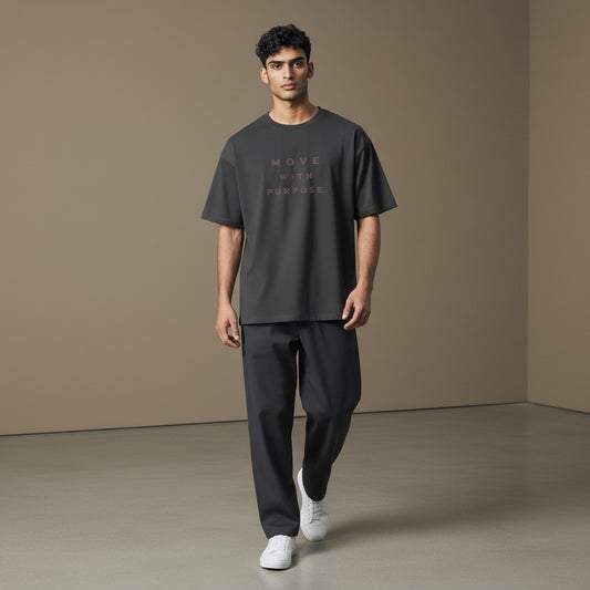 Omina dark grey heavyweight cotton t-shirt with "MOVE WITH PURPOSE." text graphic on chest. Relaxed fit, crew neck.