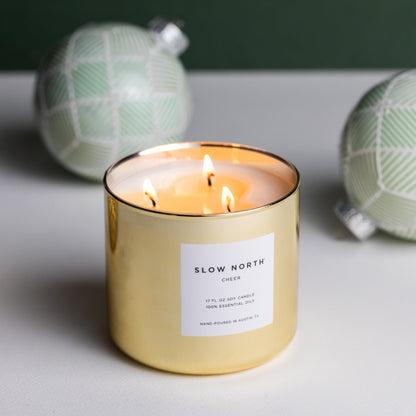 Slow North Cheer Signature 3-Wick Candle with seasonal design and three wicks, perfect for cozy ambiance.
