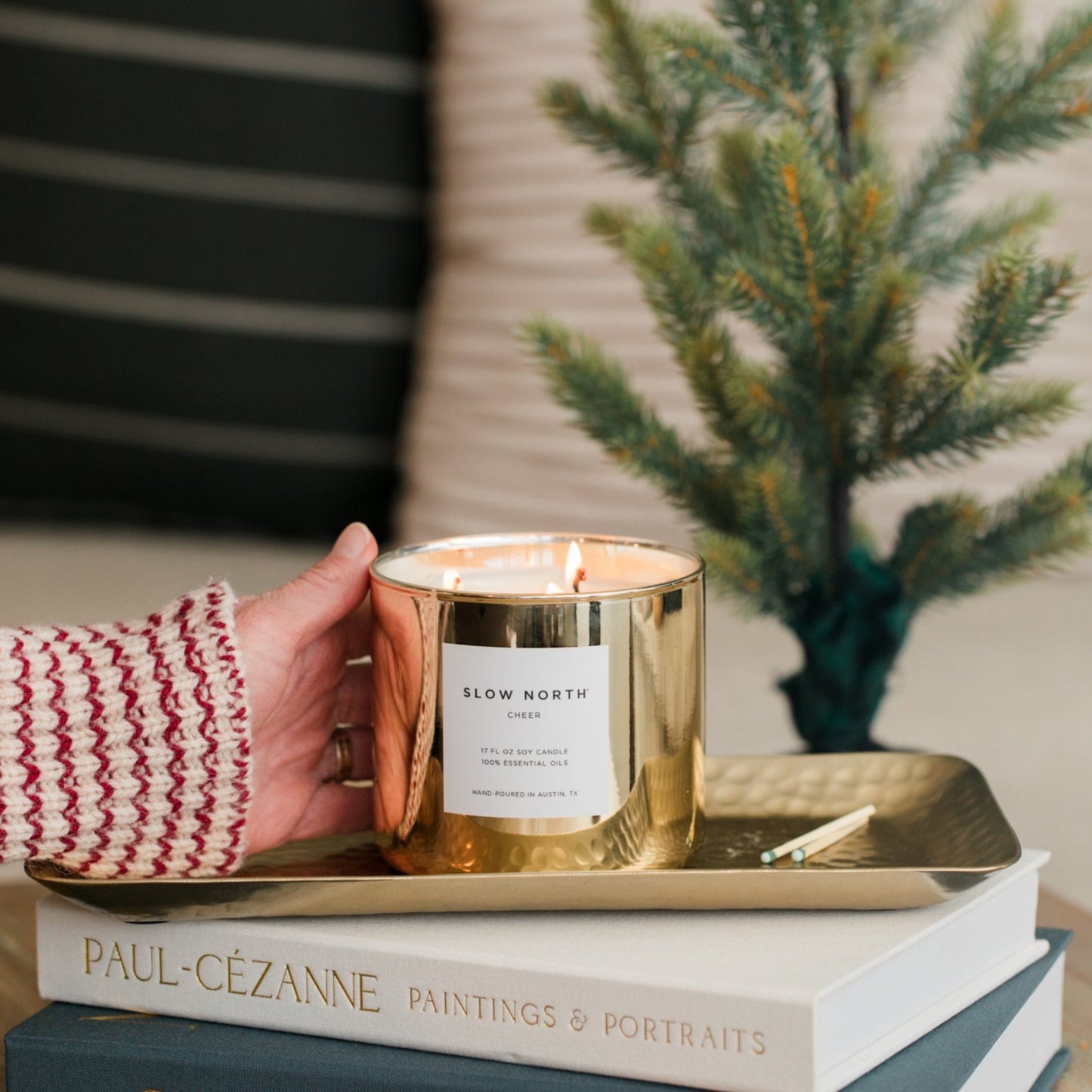 Slow North Cheer Signature 3-Wick Candle with festive seasonal design and three wicks in a glass jar.