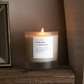 Frosted candle from Slow North's Embers + Leather Signature Candle line featuring vetiver, cedar, and patchouli scents.