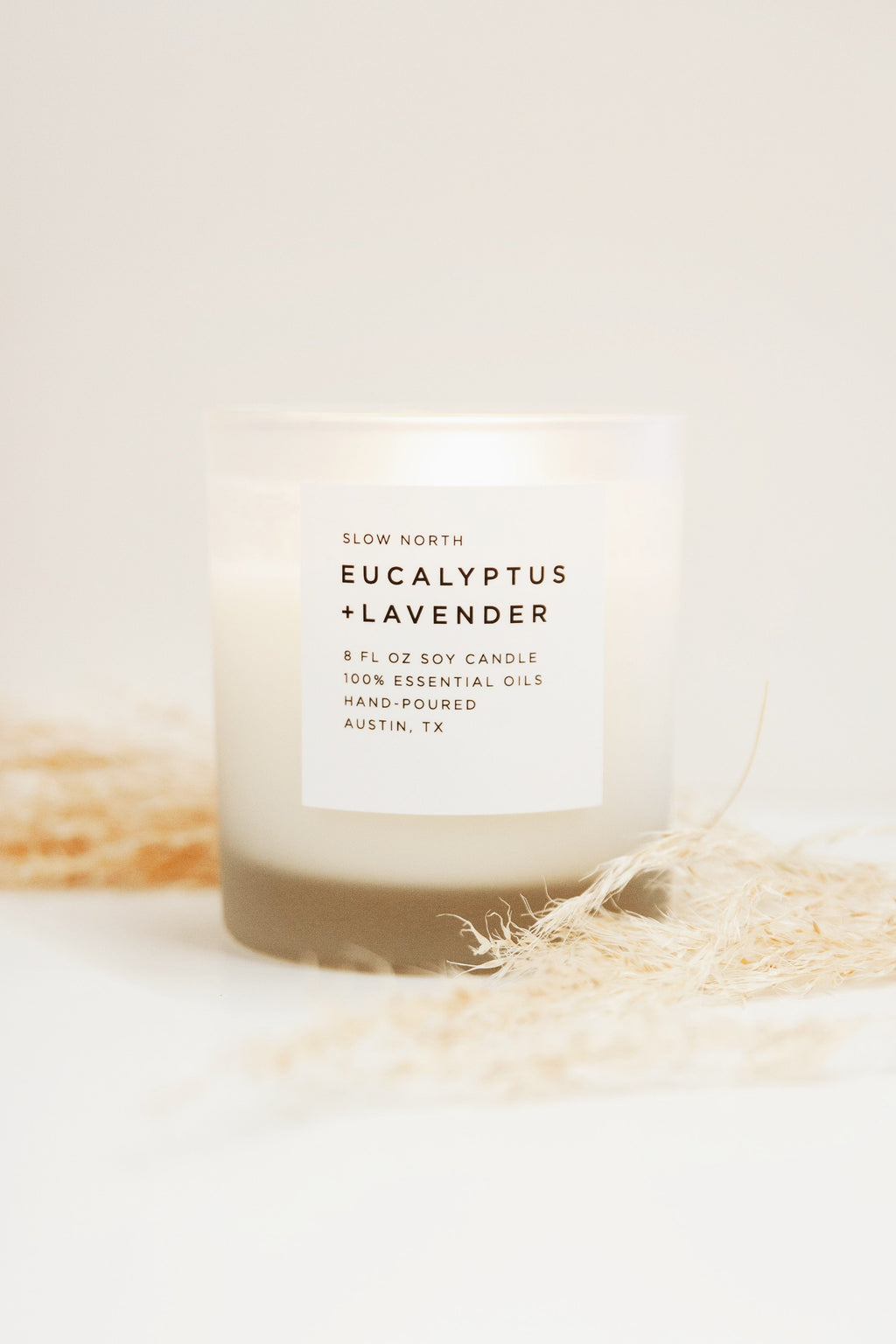 Frosted soy candle with eucalyptus and lavender scent by Slow North, 8oz size, featuring a frosted glass container.