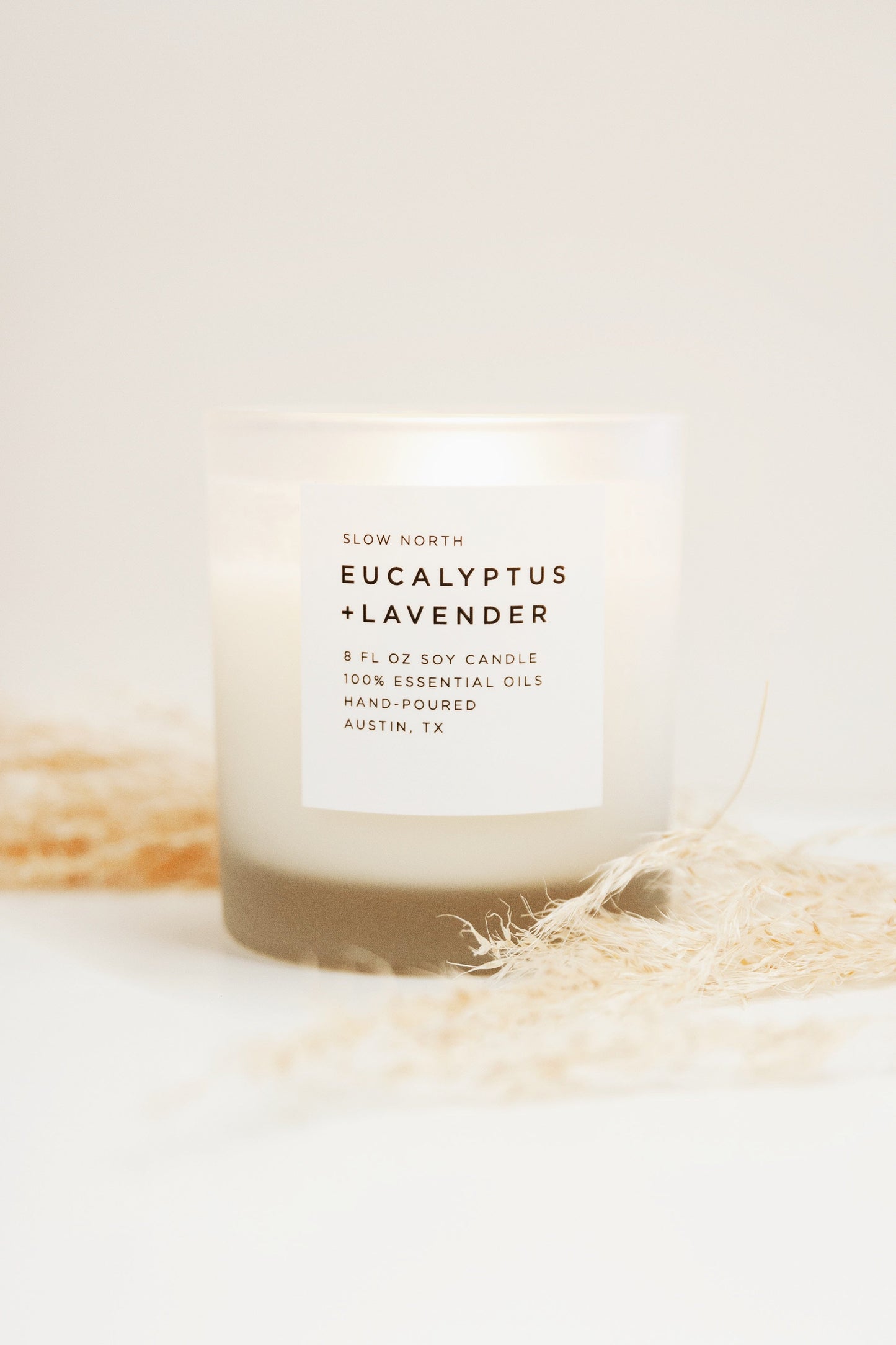 Frosted soy candle with eucalyptus and lavender scent by Slow North, 8oz size, featuring a frosted glass container.