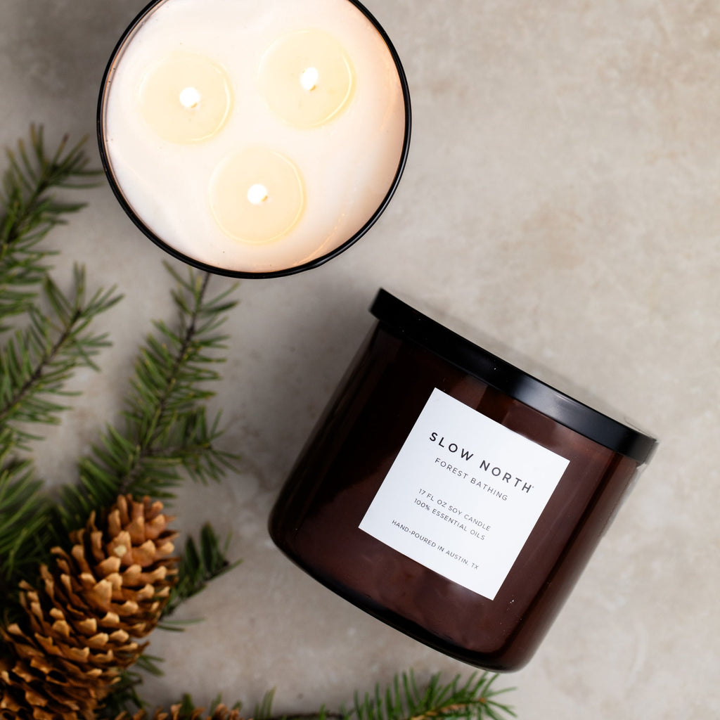 Slow North Forest Bathing Signature 3-Wick Candle with natural soy wax and forest-inspired aroma, showcasing three wicks and a minimalist design.