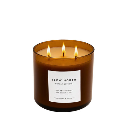 Slow North Forest Bathing Signature 3-Wick Candle with lush green forest imagery and natural wooden accents.