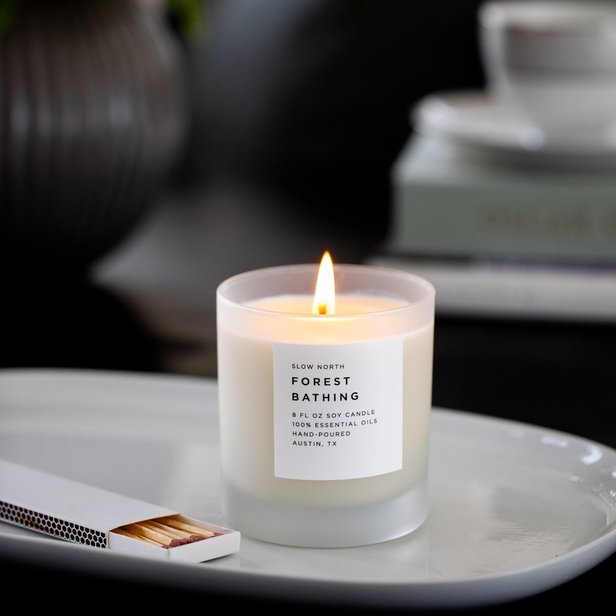 Frosted Candle by Slow North featuring forest-inspired scent of fir, pine, and patchouli in a frosted glass container.