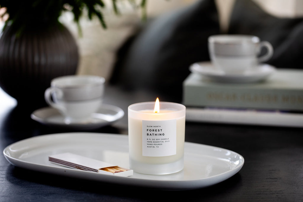 Frosted Forest Bathing Signature Candle by Slow North with fir, pine, and patchouli scent, featuring a frosted glass design.