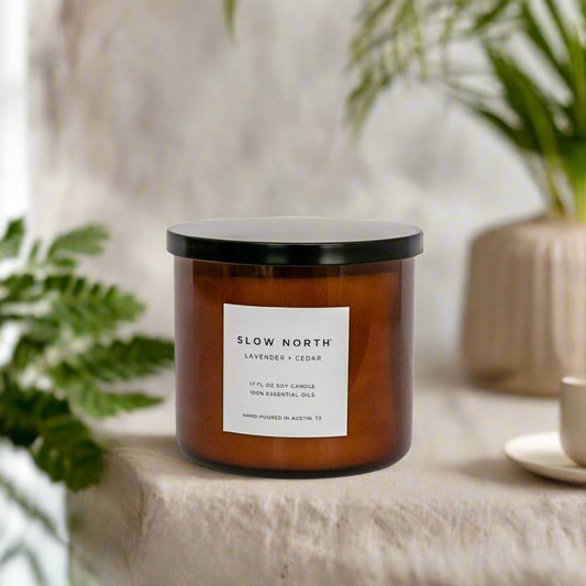 Slow North Lavender + Cedar Signature 3-Wick Candle with lavender and cedar scent, featuring a glass jar and three wicks for a relaxing ambiance.
