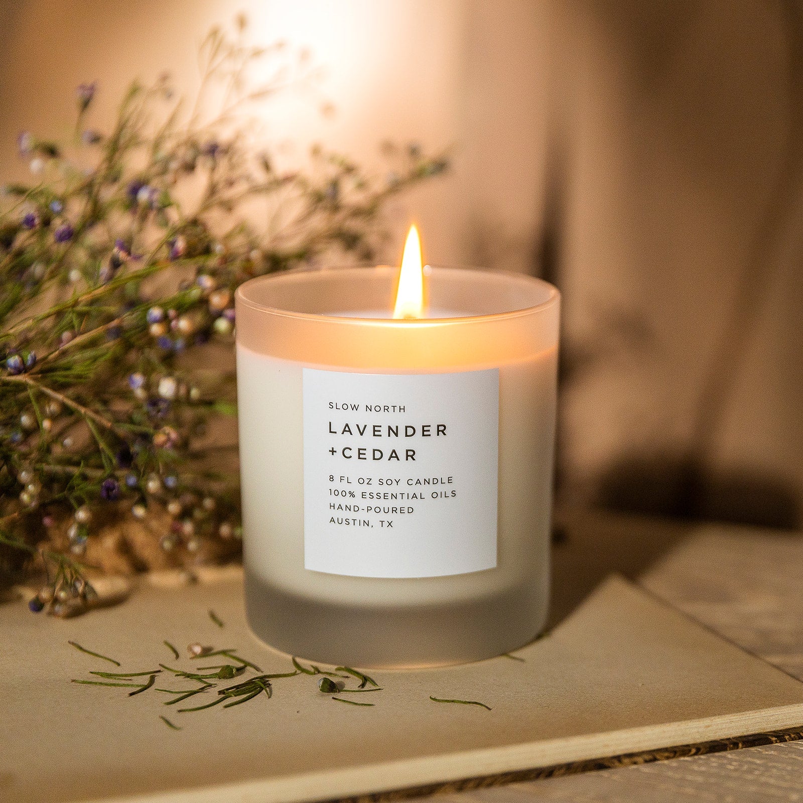 Frosted candle by Slow North with lavender and cedar scent in an 8oz glass jar, showcasing the candle's frosted finish and natural aroma.