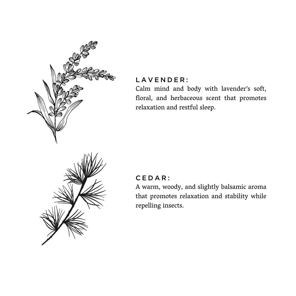 Frosted lavender and cedar-scented candle by Slow North featuring a frosted glass container and a lit wick.
