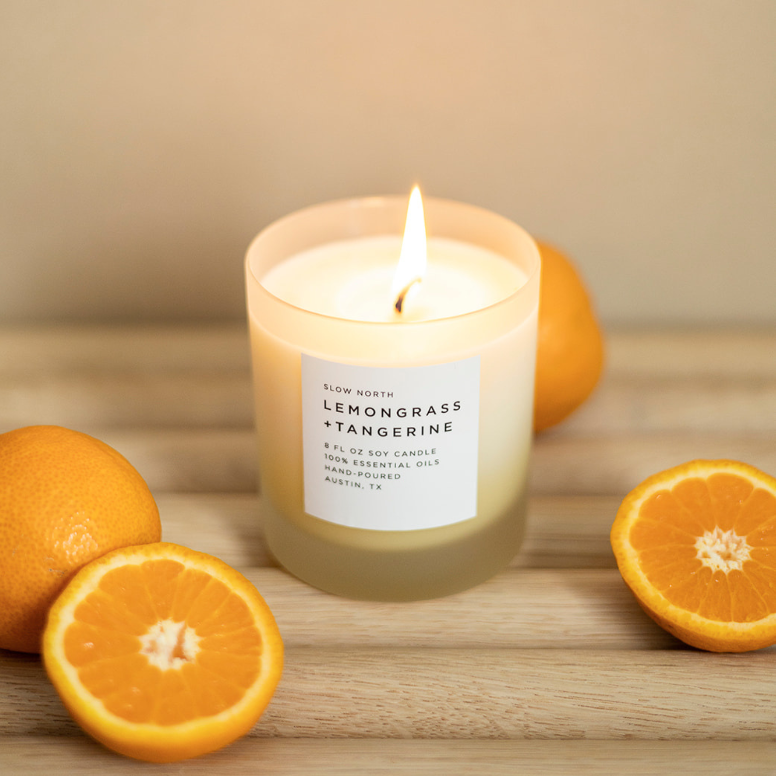 Frosted candle by Slow North with lemongrass and tangerine scent, 8oz size, featuring a textured frosted glass container.