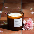 Slow North Midnight Garden Signature 3-Wick Candle with lavender, rosemary, and geranium floral scents in a glass jar.