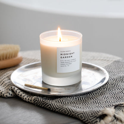 Frosted candle from Slow North’s Midnight Garden collection with lavender, rosemary, and geranium scent.