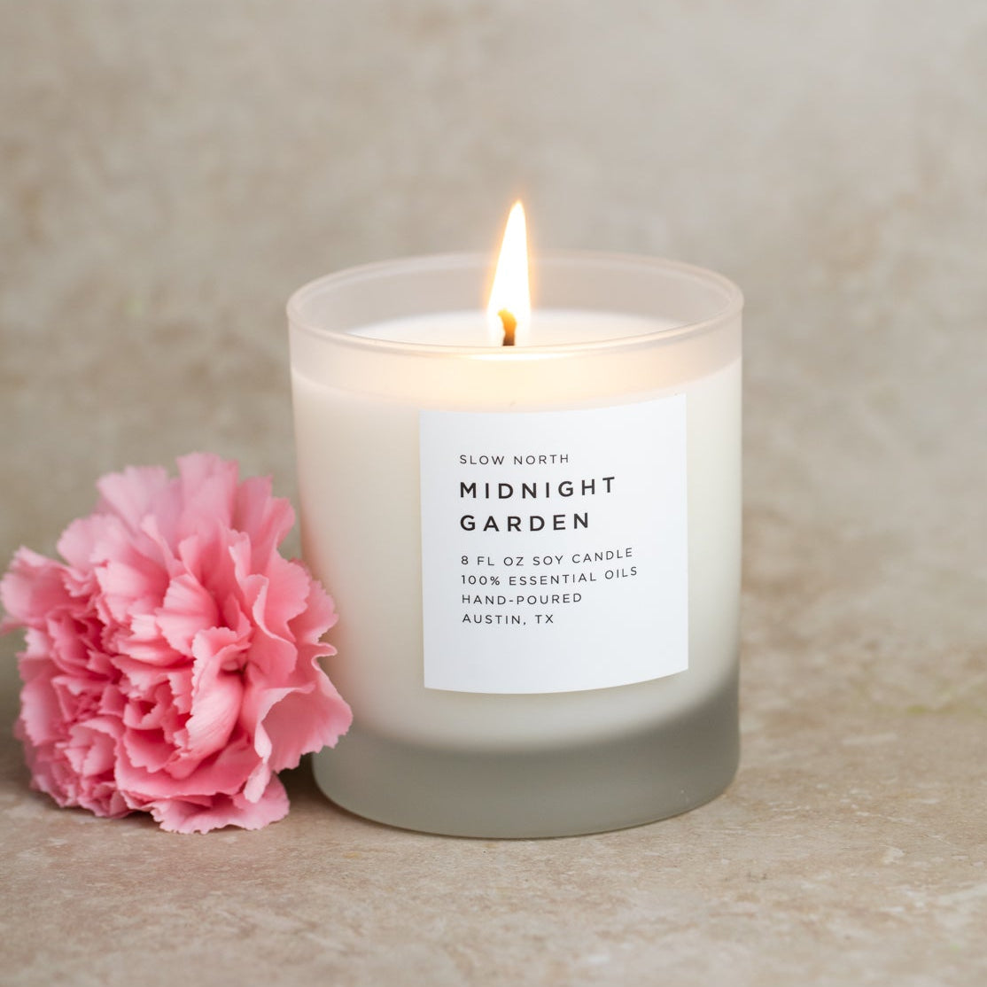 Frosted candle from Slow North's Midnight Garden collection with lavender, rosemary, and geranium scent.
