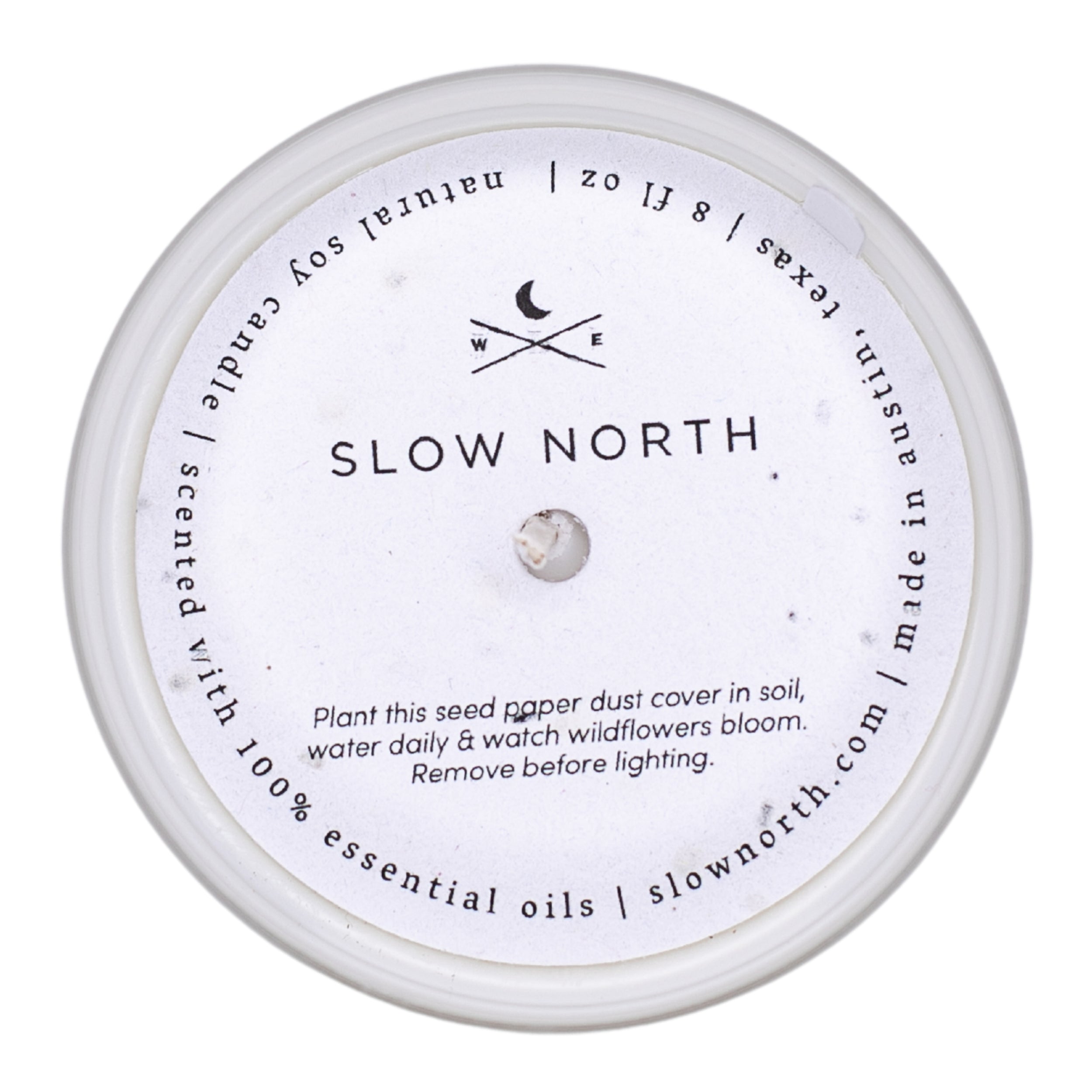 Frosted candle from Slow North featuring lemongrass and tangerine scent, with a dust cover and elegant design.