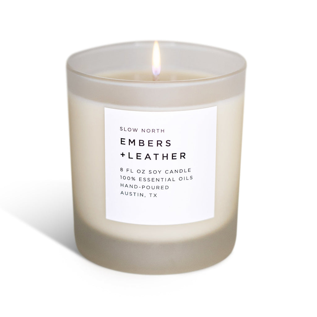Frosted Embers + Leather candle by Slow North featuring vetiver, cedar, and patchouli in a stylish glass container.