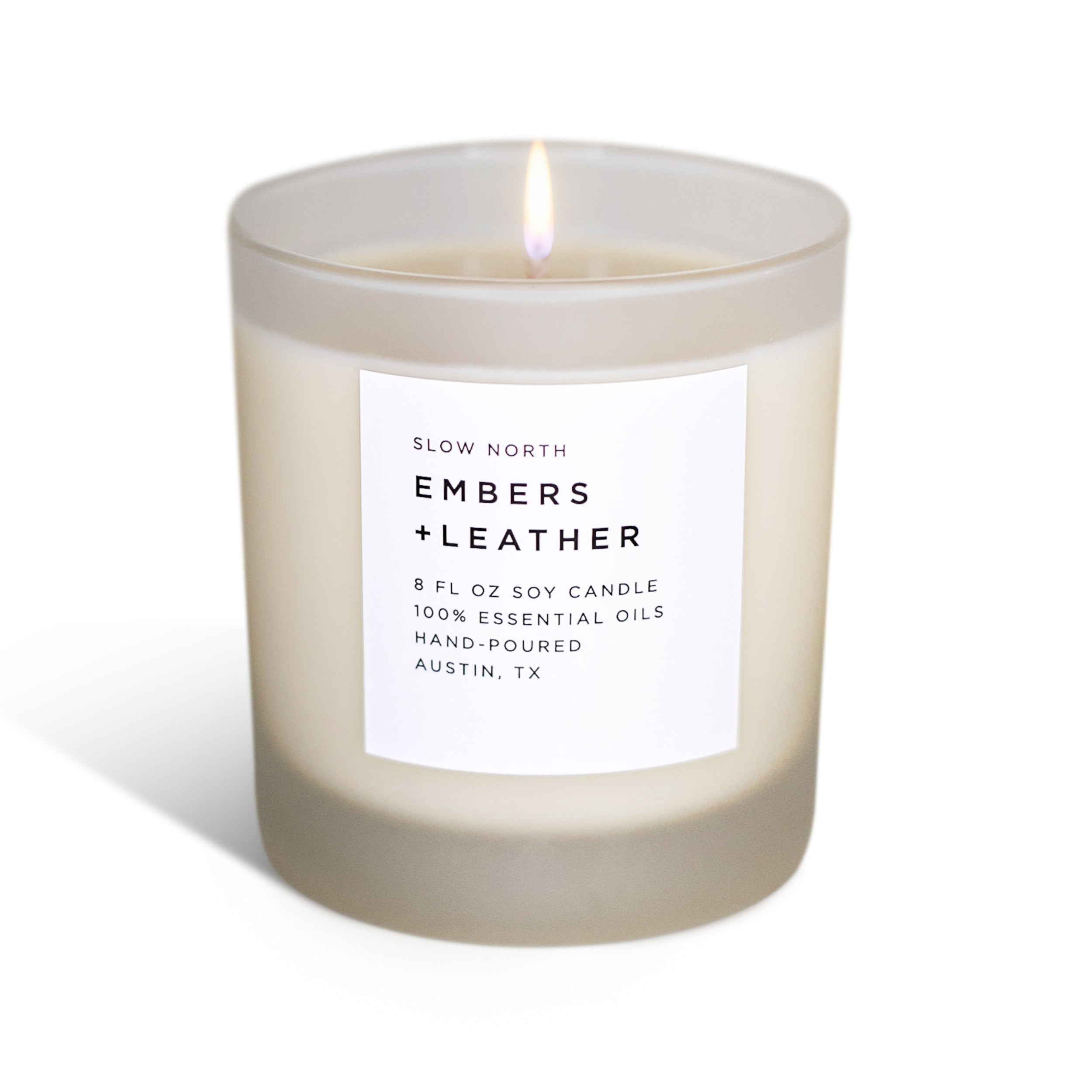 Frosted Embers + Leather candle by Slow North featuring vetiver, cedar, and patchouli in a stylish glass container.