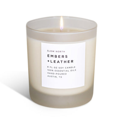 Frosted Embers + Leather candle by Slow North featuring vetiver, cedar, and patchouli in a stylish glass container.