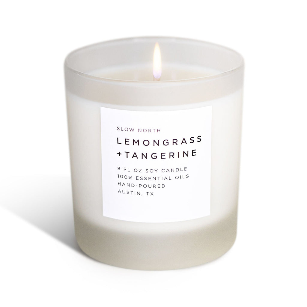 Frosted candle by Slow North with lemongrass and tangerine scent, showcasing a minimalist frosted glass holder.