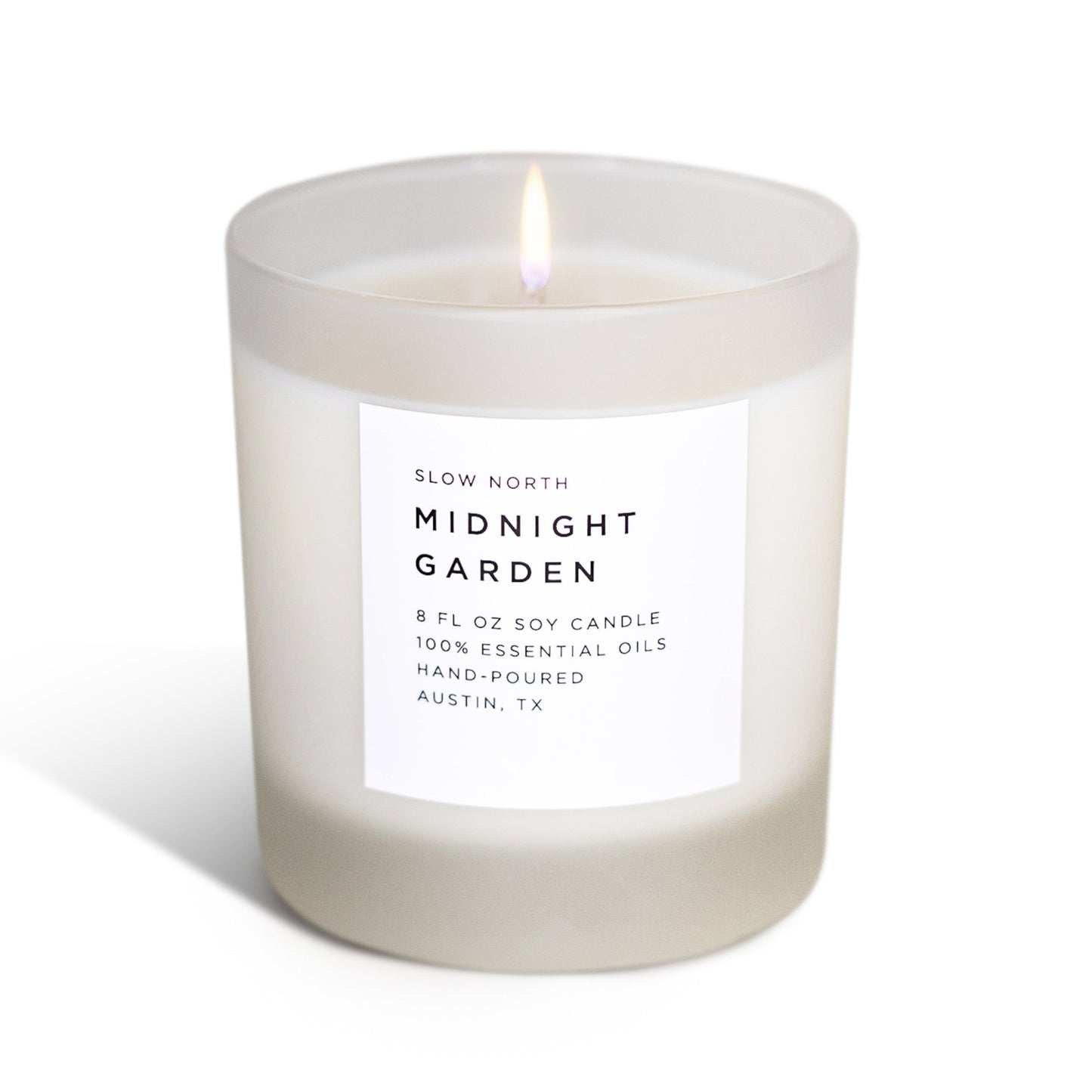 Frosted Midnight Garden soy candle by Slow North featuring lavender, rosemary, and geranium for a calming, natural ambiance.