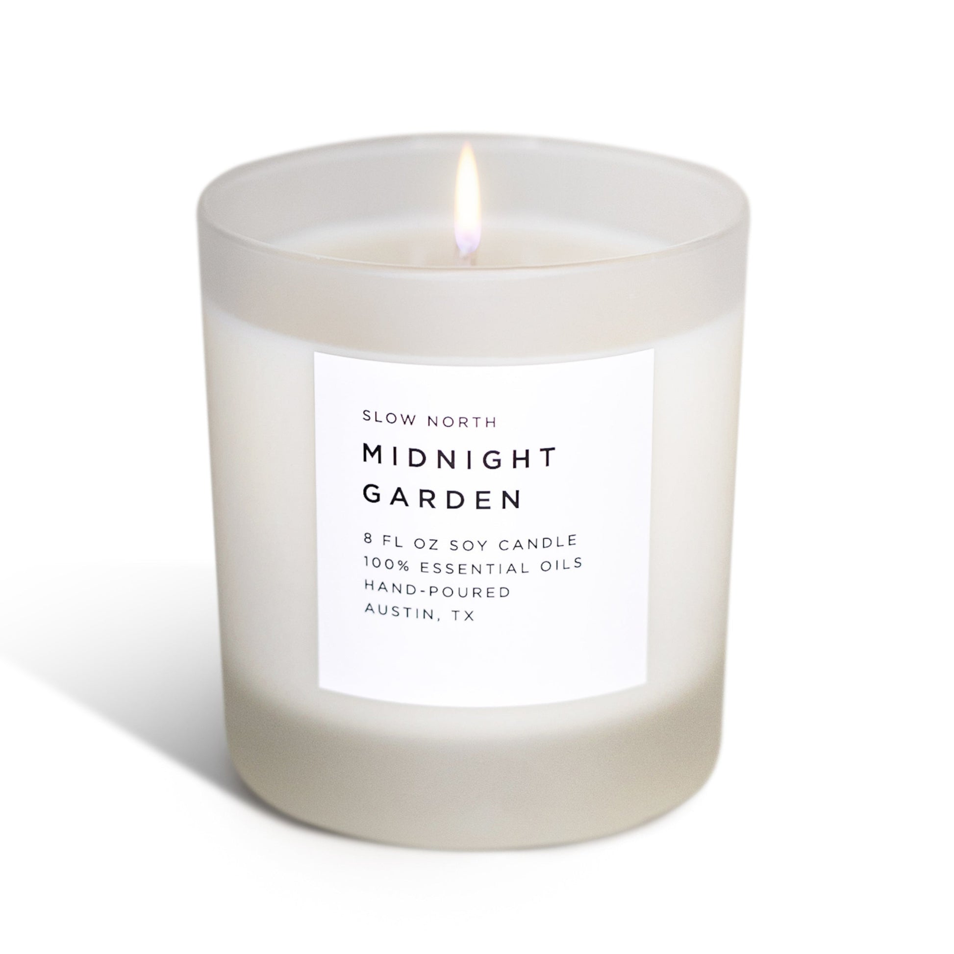 Frosted Midnight Garden soy candle by Slow North featuring lavender, rosemary, and geranium for a calming, natural ambiance.