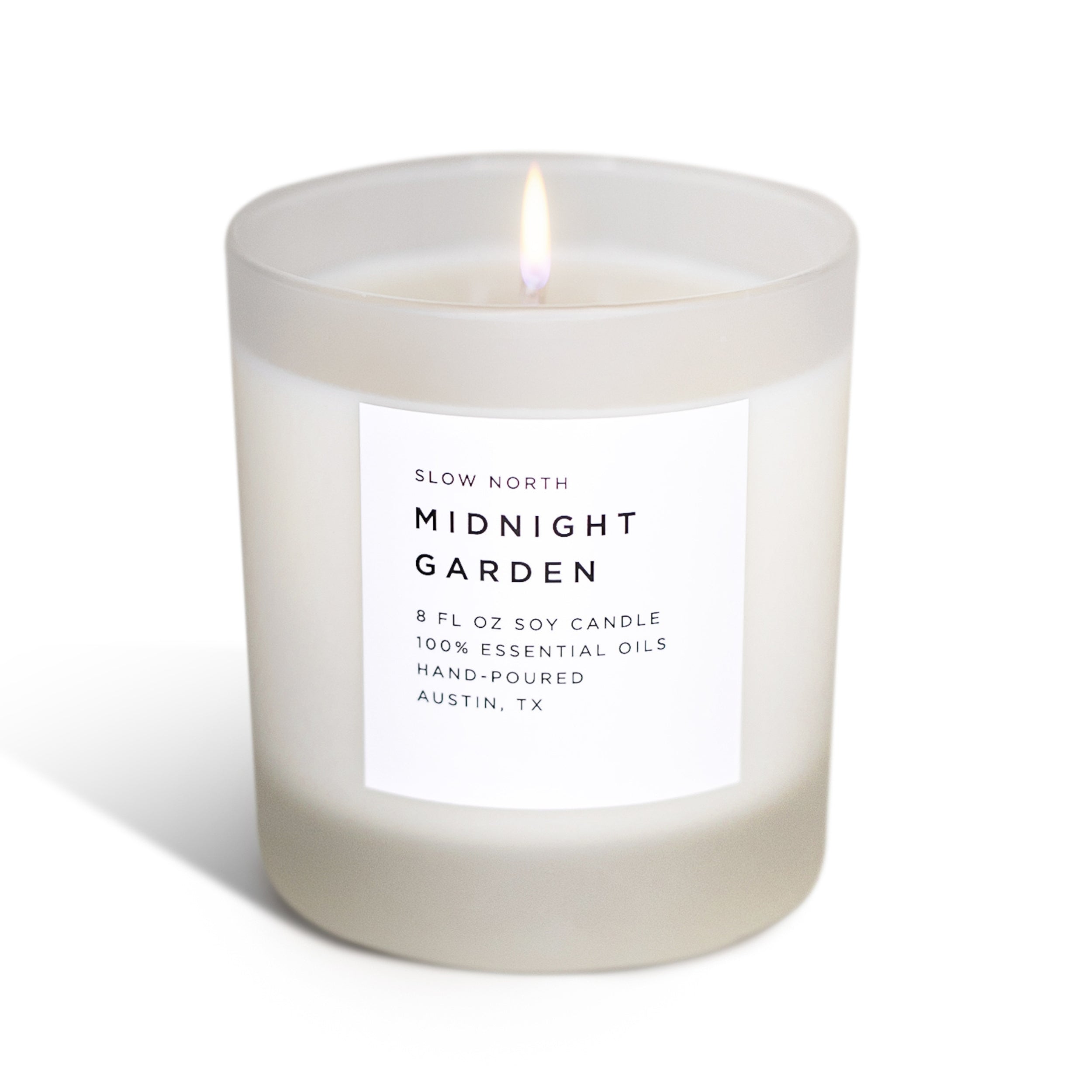Frosted Midnight Garden soy candle by Slow North featuring lavender, rosemary, and geranium for a calming, natural ambiance.