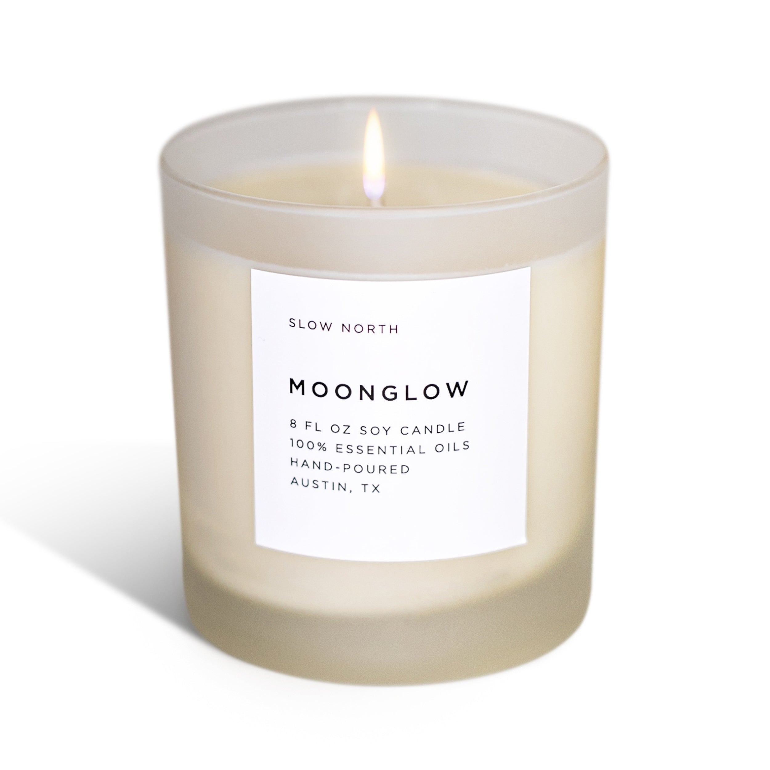 Frosted candle by Slow North featuring Moonglow signature scent with patchouli, cinnamon, and black pepper in a non-toxic design