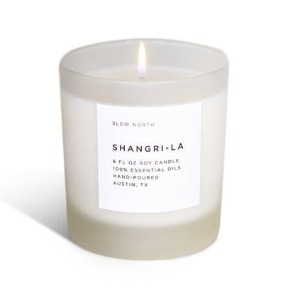 Frosted candle from Slow North's Shangri-La Signature collection with eucalyptus, lavender, and lemongrass scent.
