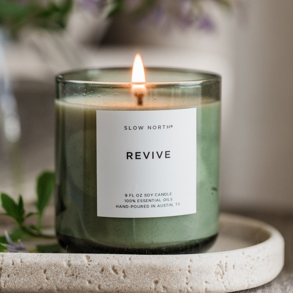 Slow North Revive Spa Collection candle with a sleek jar, featuring a calming design and natural wax for a relaxing spa ambiance.