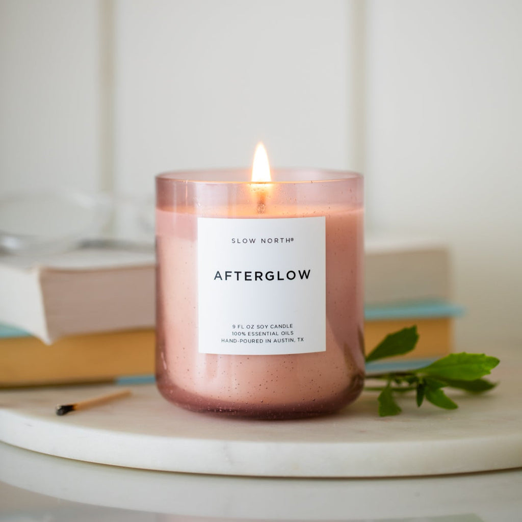 Slow North Afterglow spa candle with a sleek glass container and soft, ambient glow, perfect for creating a relaxing atmosphere.