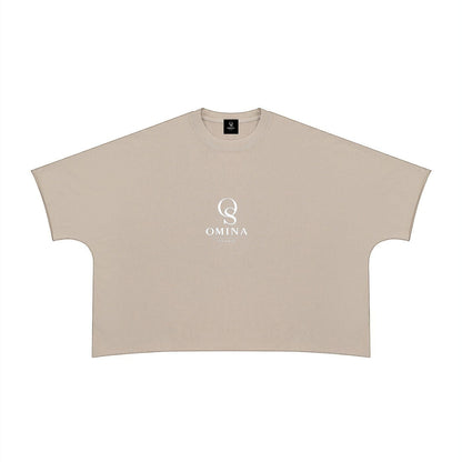 Omina beige 100% cotton unisex heavyweight boxy t-shirt with raw edge hem and crew neck, featuring a white Omina Studio logo on the chest.