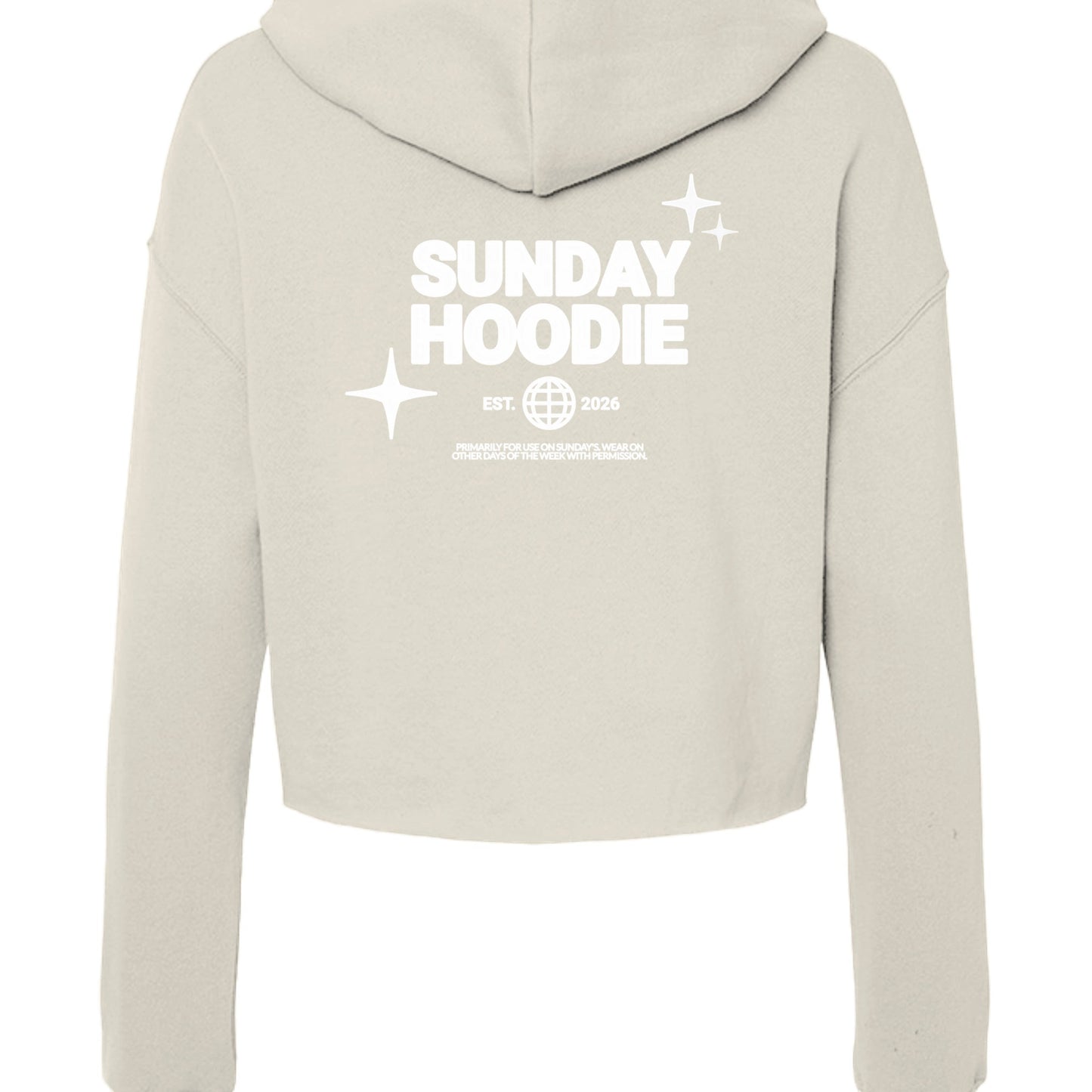 Back view of Omina Essentials beige cropped Sunday hoodie with white graphic print featuring stars and text.