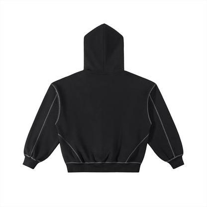 Back view of Omina black boxy fleece zip hoodie with white contrast stitching, drop shoulders, and ribbed hem.
