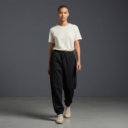 Model wearing Omina black cotton blend jogged sweatpants with elastic drawstring waist and side pockets