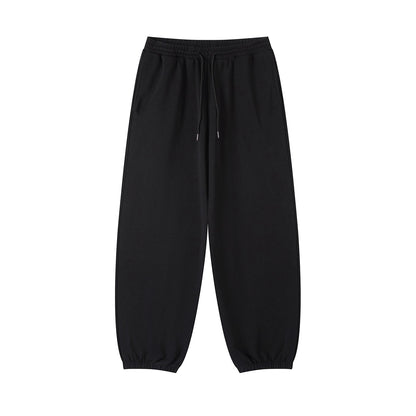 Omina black cotton blend jogged sweatpants with an elastic drawstring waist and cuffed ankles.