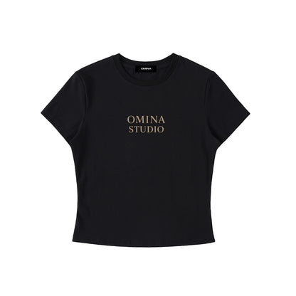 Omina black cotton-spandex blend crewneck t-shirt with "OMINA STUDIO" printed on chest. Bodycon fit.