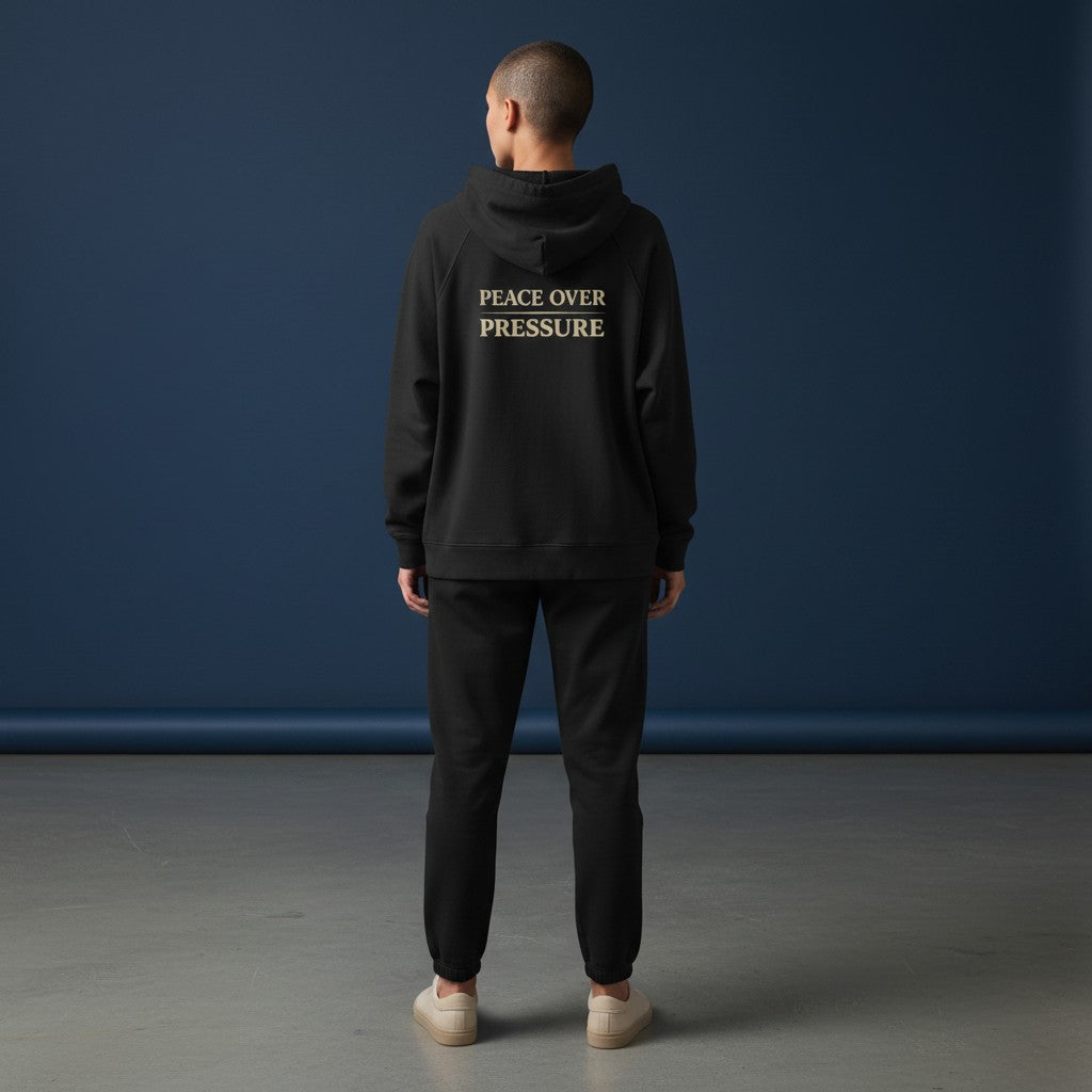 Omina black full-zip hoodie with "PEACE OVER PRESSURE" graphic on back. Made of 100% combed cotton.