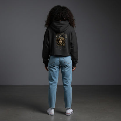Omina black heavyweight cotton-blend cropped zip hoodie with "Move With Intention" graphic and Medusa illustration.