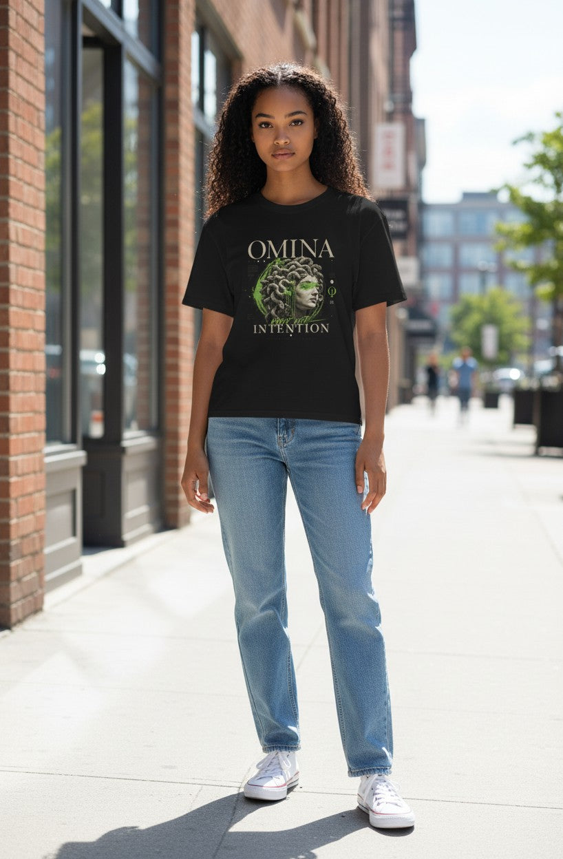 Omina black heavyweight tee with a bold Medusa head graphic and "Move With Intention" text.