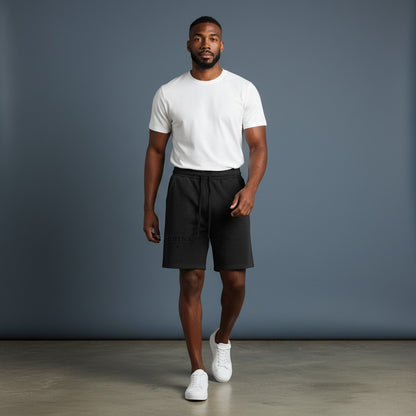 Omina black mineral wash waffle knit shorts with elastic waistband and drawstring. Relaxed fit, textured fabric.