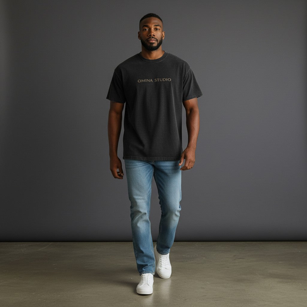 Omina black mineral wash waffle knit t-shirt with "OMINA STUDIO" embroidered on the chest.