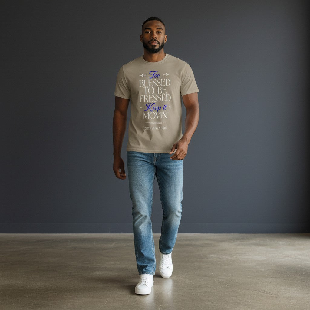 Model wearing an Omina heavyweight cotton tee in beige with Blessed, Not Pressed graphic text in blue and white.