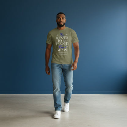 Man wearing an Omina olive green heavyweight cotton t-shirt with Blessed, Not Pressed graphic text, paired with jeans.
