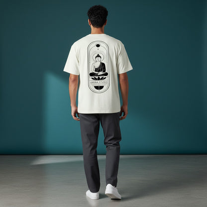 Model wearing an Omina heavyweight cream t-shirt with a black Buddha graphic on the back, relaxed fit.