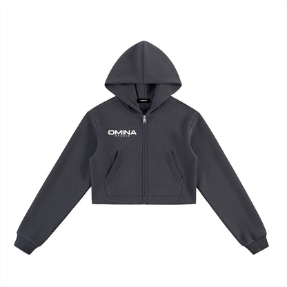 Omina dark grey cotton-blend fleece cropped zip hoodie with white Omina Studio graphic detailing and pockets.