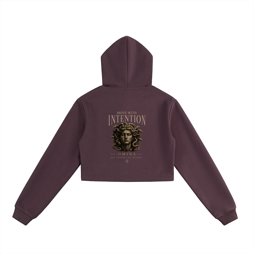 Omina dark plum cropped zip hoodie with hood, featuring "Move With Intention" text and Medusa graphic.