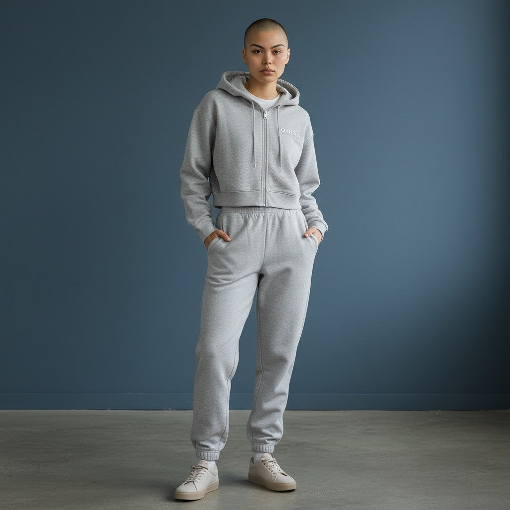 Omina light grey cotton blend cropped zip-up hoodie with drawstring hood and logo detail.