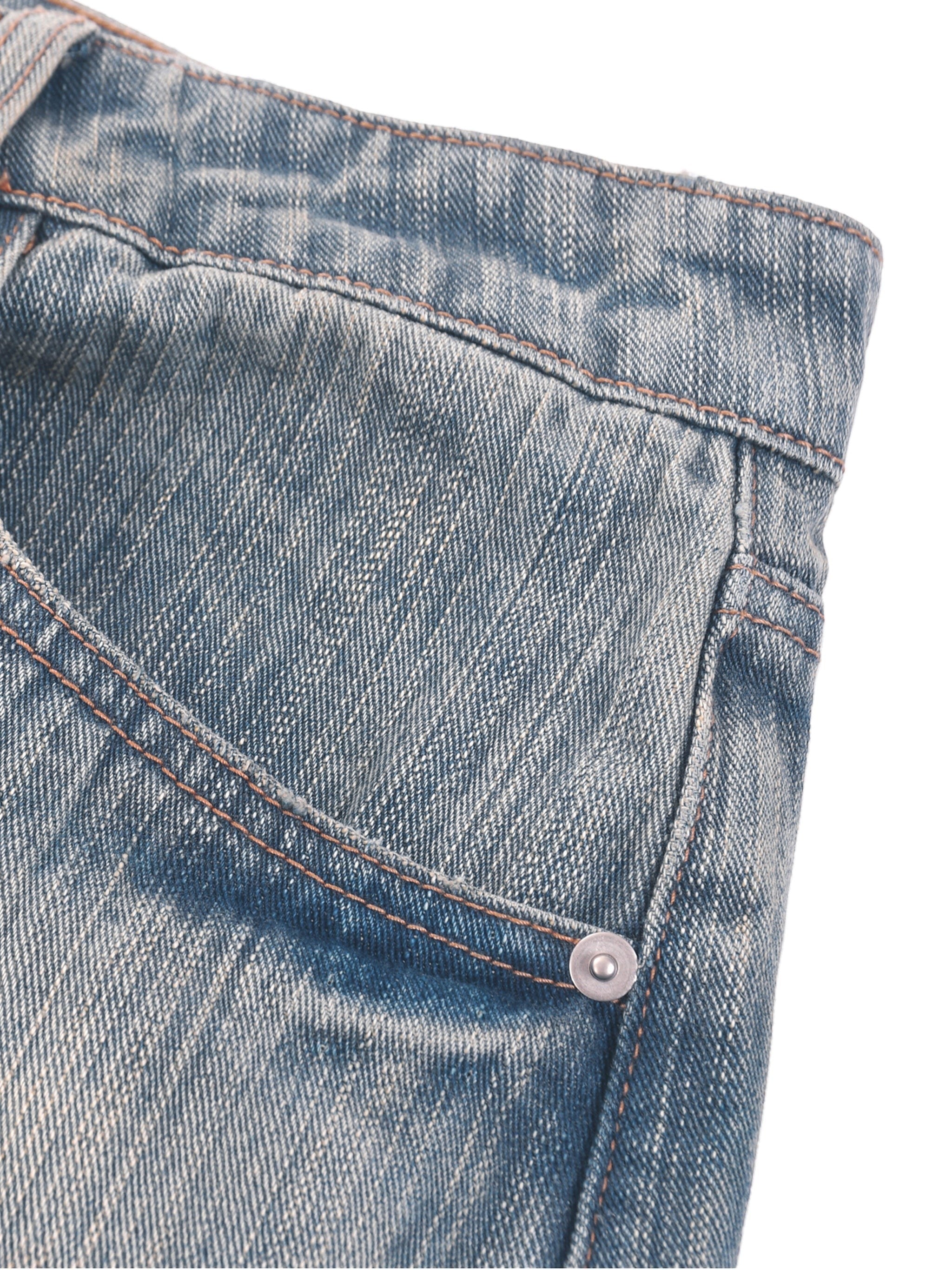 OMINA vintage wash distressed denim jeans with a relaxed fit and copper button detail.