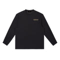 Omina Essentials black cotton blend long-sleeve t-shirt with crewneck and relaxed fit. Features subtle gold logo.