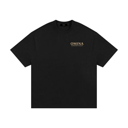 OMINA ESSENTIALS black heavyweight cotton t-shirt with oversized fit and drop shoulders. Minimal gold logo on chest.